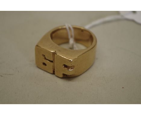 A heavy 'GF' initialled gold ring, unmarked, 42.5g 