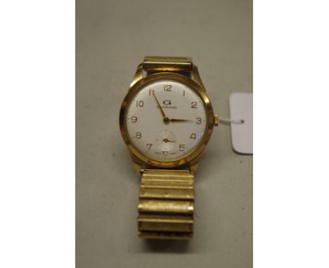 A vintage Garrard 9ct gold manual wind wristwatch, 32mm, with&nbsp;expanding metal bracelet and associated box. 