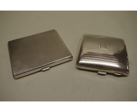 Two silver engine turned cigarette cases, 213g all in. 