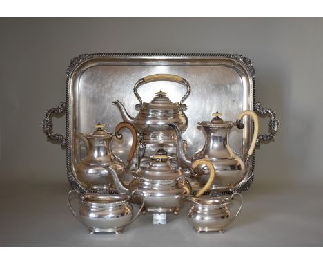 An impressive silver seven piece teaset, comprising a large twin handled tray, 76cm wide, 4600g approximately; spirit kettle 