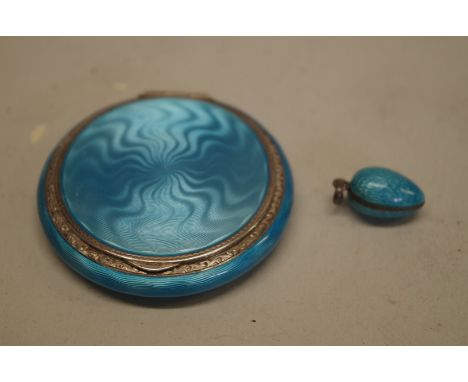 A silver and blue guilloche enamel compact, import mark London 1927, H C Freeman Ltd, 5cm; together with a similar unmarked p