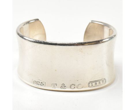 A Tiffany &amp; Co 1837 sterling silver wide cuff bangle. The Tiffany open cuff bangle stamped with 'T &amp; Co', '1837' and 