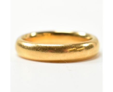 A hallmarked 22ct gold band ring. The band ring hallmarked for Birmingham, 1930. Maker's mark KBSP. Size N.5.&nbsp;Weighs 7.9