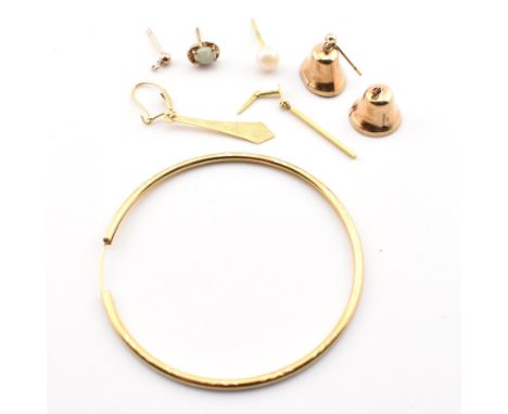 Assorted 9ct gold earring fragments. The lot to include a single hallmarked 9ct gold endless hoop earring, hallmarked with im