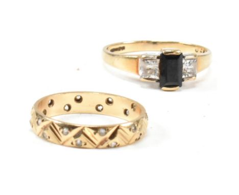 A hallmarked 9ct gold, sapphire and CZ ring and a hallmarked 9ct gold and white stone band ring. The rings to include a hallm