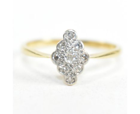 An 18ct gold, platinum and diamond cluster ring. The ring having a central round cut diamond surrounded by a halo of eight ro