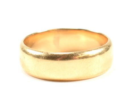 A hallmarked 18ct gold band ring. The band ring hallmarked for Birmingham, 1926. Maker's mark F.F &amp; Co for Fetter, Forbes