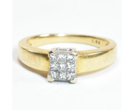 A hallmarked 18ct gold and diamond cluster ring. The ring set with six princess cut diamonds to a square head. Hallmarked for