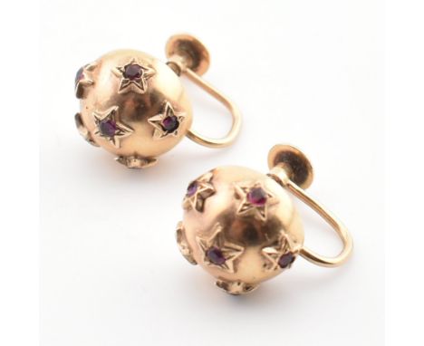 A pair of hallmarked 9ct gold and ruby domed screw back earrings. Hallmarked for Chester, 1954. Earrings weigh 3.2g.&nbsp;All