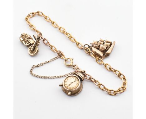 A hallmarked 9ct gold charm bracelet. The bracelet strung with three yellow metal charms including a motorbike, galleon and a