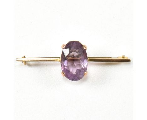 A yellow metal and amethyst bar brooch pin. The brooch marked WBs 9. Tests indicate 9ct gold to the bar and mount. Total weig