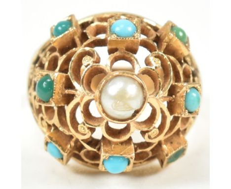 An 18ct gold pearl and turquoise bombe ring. The ring having a pierced filigree style domed head set with a central pearl wit