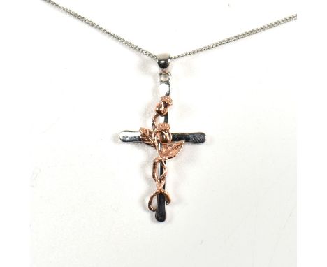 A hallmarked silver and rose gold Clogau cross pendant necklace. The Clogau necklace having a sterling silver cross pendant w