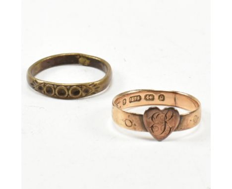 A Victorian hallmarked 9ct gold heart signet ring together with a gold tone metal ring. The heart ring having a monogram to t