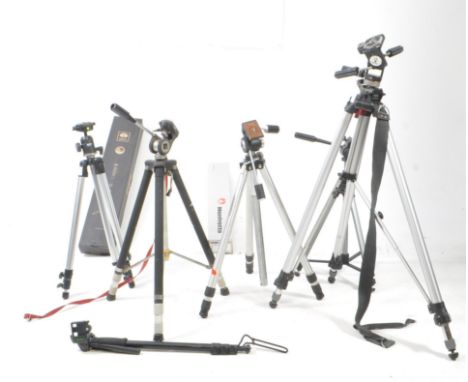 A collection of aluminiun metal camera tripod adjustable stands. Incluidng a boxed Sirui P-204SR, Italian Manfrotto #29, Caml