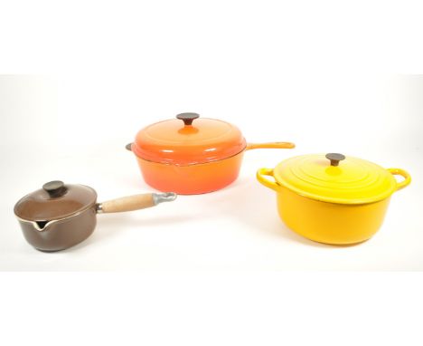 Le Creuset - A collection of three vintage 20th century Le Creuset cast iron enamelled pans. The collection to include a larg