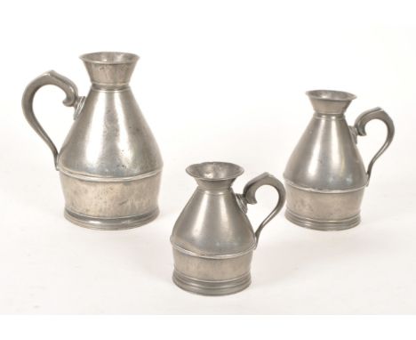 Austen and Son Co. - A set of three 19th century Irish pewter haystack jugs / measures. Each of graduating size, measuring 1 