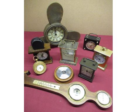 Metamec quartz marble and brass finished carriage cock, a French lacquered brass eight day alarm clock, a strut clock in the 