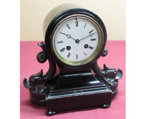 19th C mantel clock ebonised drum head case supported by stylised fish on shaped and moulded base, white enamel dial with rom