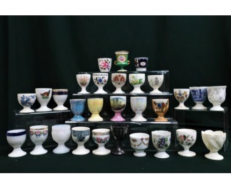 Collection of egg cups by New Chelsea, Shelley, Royal Crown Derby, Spode, Wedgwood, Coalport, Grosvenor etc, of various style