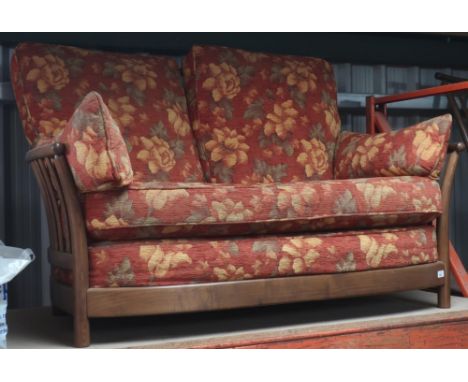 Ercol Renaissance ash-framed two-seater settee with loose rust ground floral patterned cushions approx H.100cm, D.70cm, W.130