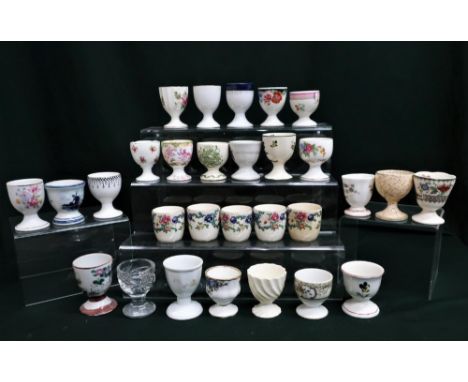 Collection of egg cups including Mintons, Royal Doulton, Royal Cauldron, Paragon, Coalport, Royal Worcester, Villeroy &amp; B