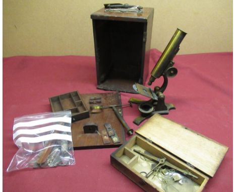 Late 19th C lacquered brass and japanned metal monocular microscope with three slides, bullseye condenser on stand etc in fit