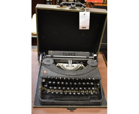 A vintage Oliver typewriter, the case with original Cunard Line sticker.