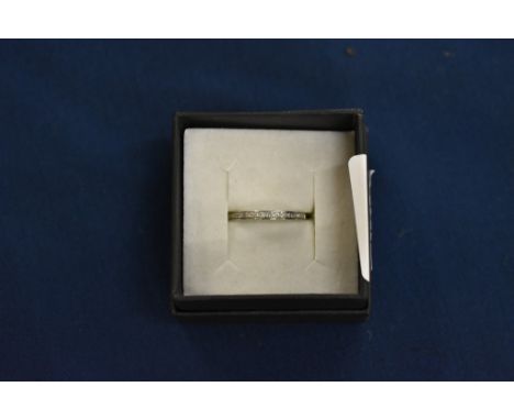 A 9ct white gold and diamond half eternity ring