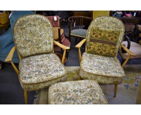 Two Ercol Windsor chairs and a foot stool with floral covering.