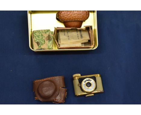 A Kunik Walter ' Petie ' miniature camera with leather cases.
