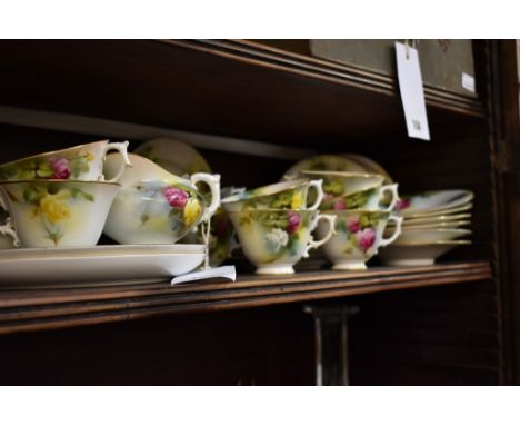 A collection of Royal Worcester porcelain dated 1909 and hand painted by M. Lander with Hadley rose pattern (34)