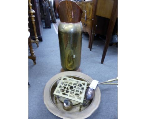 A quantity of brassware to include an oversized jug form stick stand, brass dish etc (qty)