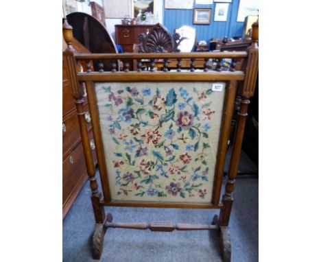 An embroidered antique firescreen.