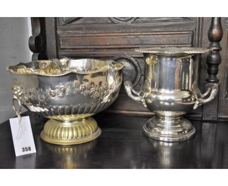 A 20th century silver plate on copper punch bowl and ladle lion mask handles, together with a silver plate trophy form ice bu