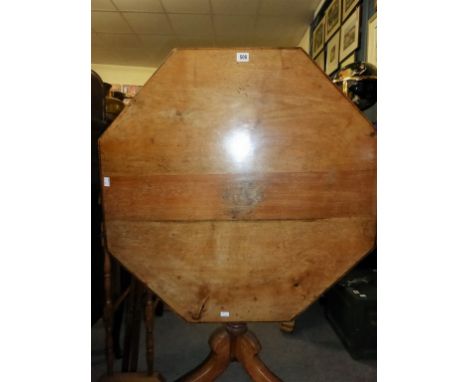 A mid-19th century octagonal walnut tilt-top tripod table