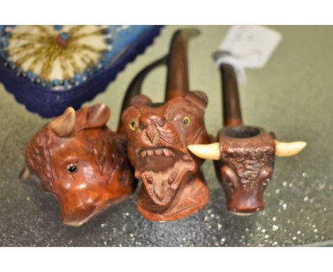 A carved bull's head pipe signed 'Brunei-Fine', glass eyes and real horn; together with a similar smaller version,