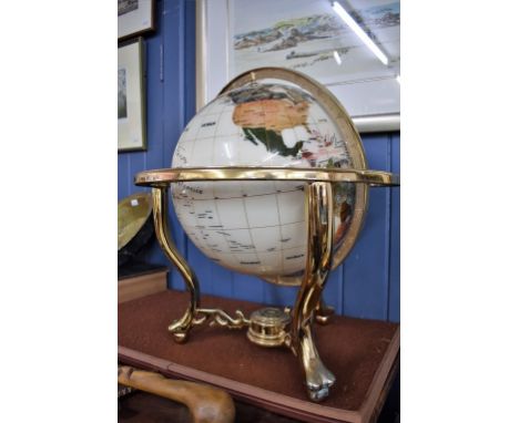 A modern day and night mineral world globe with compass inset to base.