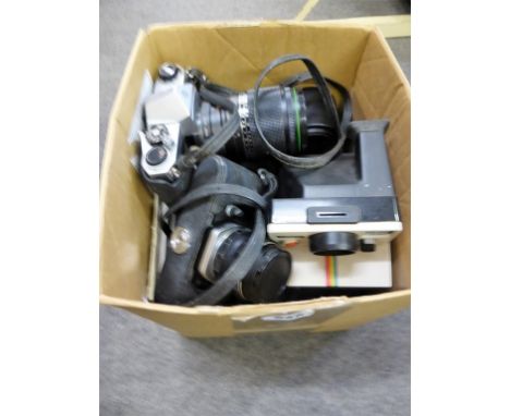 Two Pentax Asahi Spotmatic cameras, Poloroid Land camera, accessories.