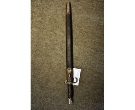 A First World War 1907 Hooked Quillon Pattern bayonet & scabbard the bayonet features riveted wooden grips and locking lug,me