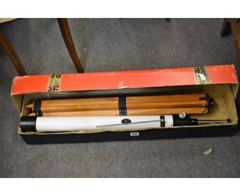 A boxed Japanese telescope with tripod