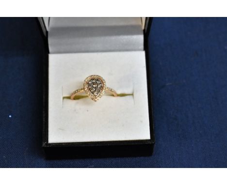 A 14ct rose gold champagne and white diamond heart shaped cluster ring