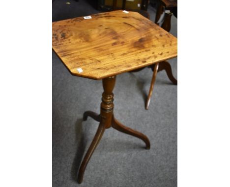 An early 19th century mahogany octagonal tilt-top tripod table