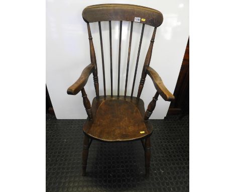 Oak Stick Back Armchair with Shaped Seat 