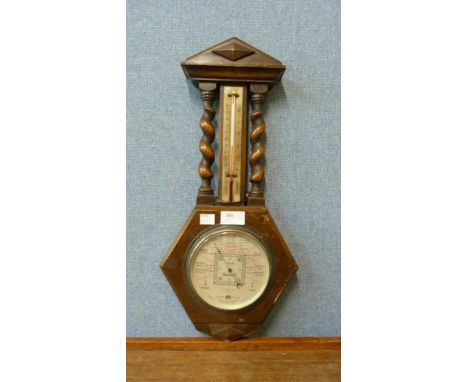 An Art Deco oak aneroid barometer 