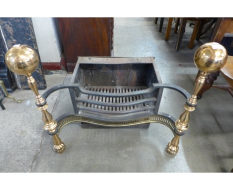 A Regency style brass and cast iron fire grate 