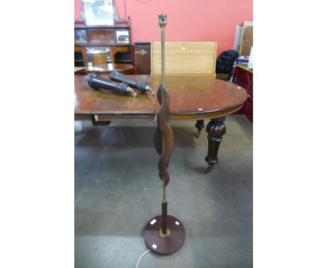 A teak standard lamp 