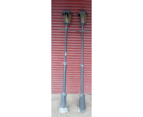 A pair of faux steel lamp posts 