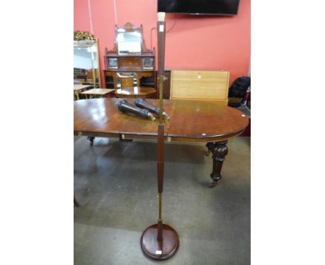 A teak standard lamp 