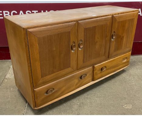 An Ercol Blonde elm Windsor sideboard 